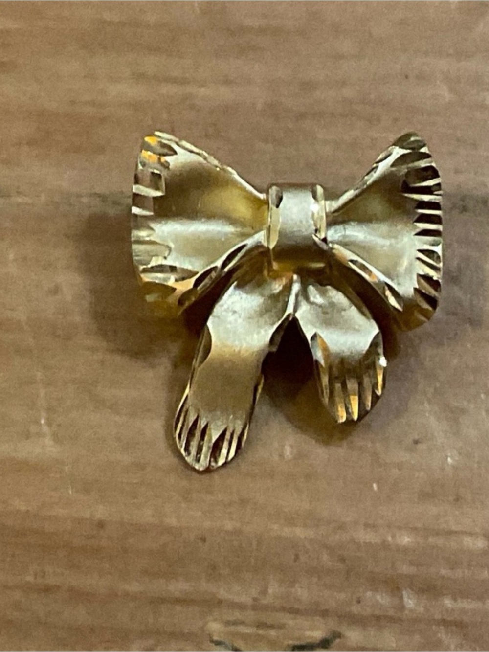 Vintage; uniqueness 14k. Yellow gold Small shinny craved bow/Ribbon Charm.